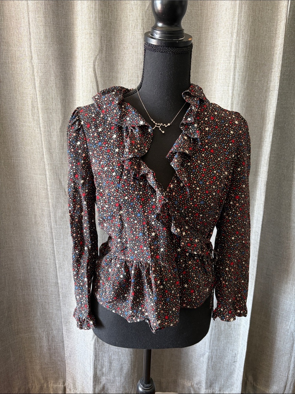Madewell Black Ruffle Wrap Blouse with Red, White, and Blue Star Print